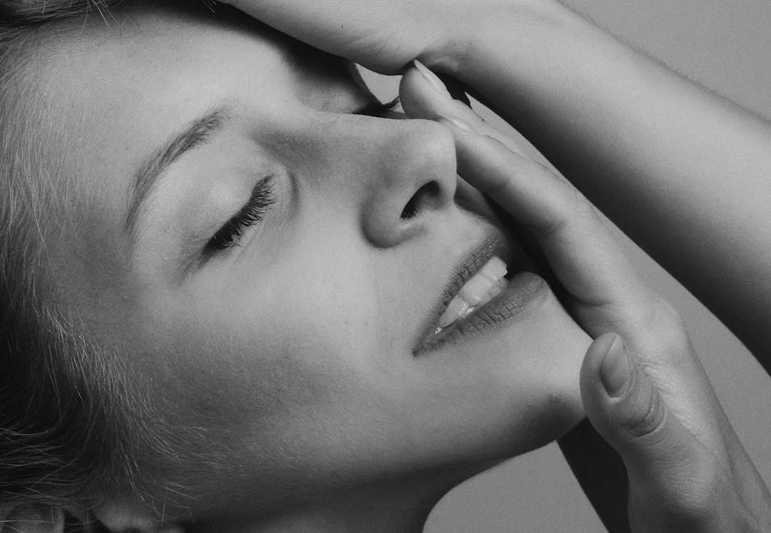 grayscale photo of woman's face
