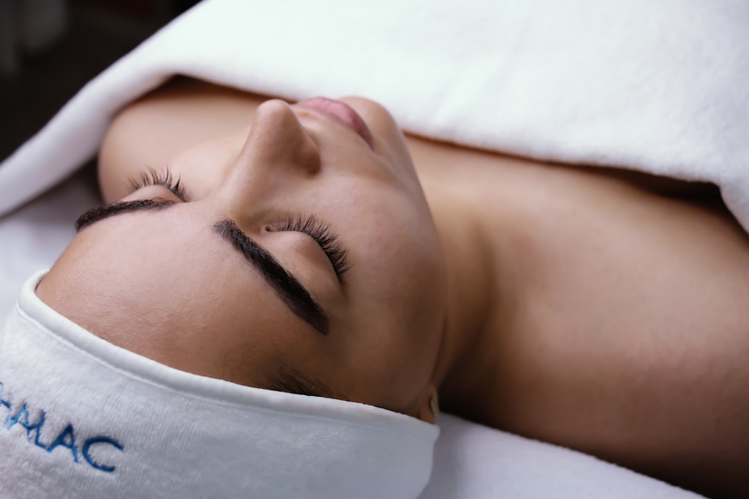 Client relaxing during a hydrafacial treatment at a spa