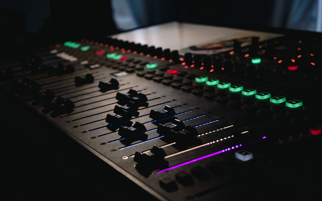 Audio mixing board with faders and controls for live sound
