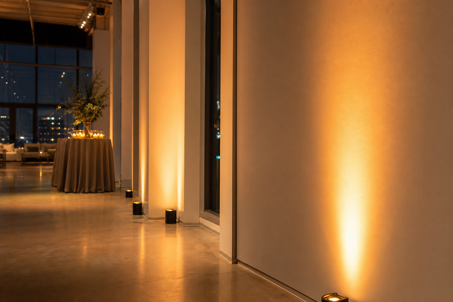 Wireless battery uplight illuminating a venue wall with colored LED light for a San Francisco event