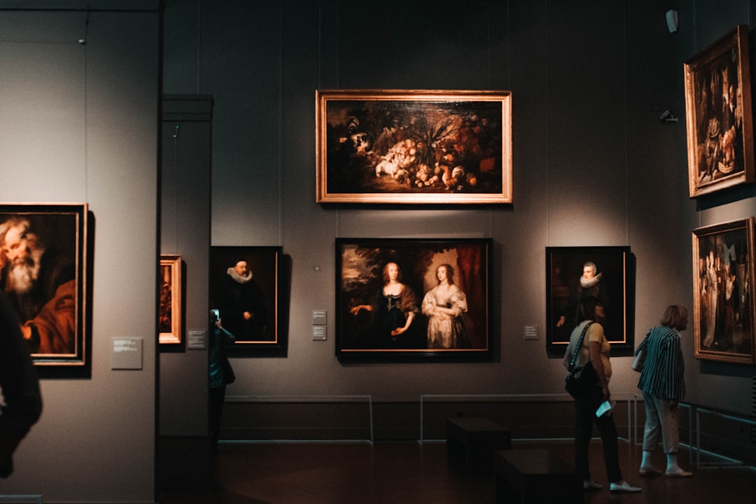 Person viewing digital art display in modern gallery space