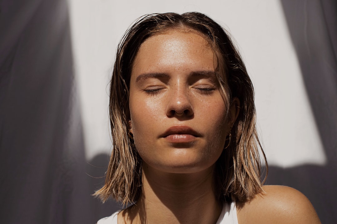 Woman with smooth, tightened facial skin after a cold contouring treatment