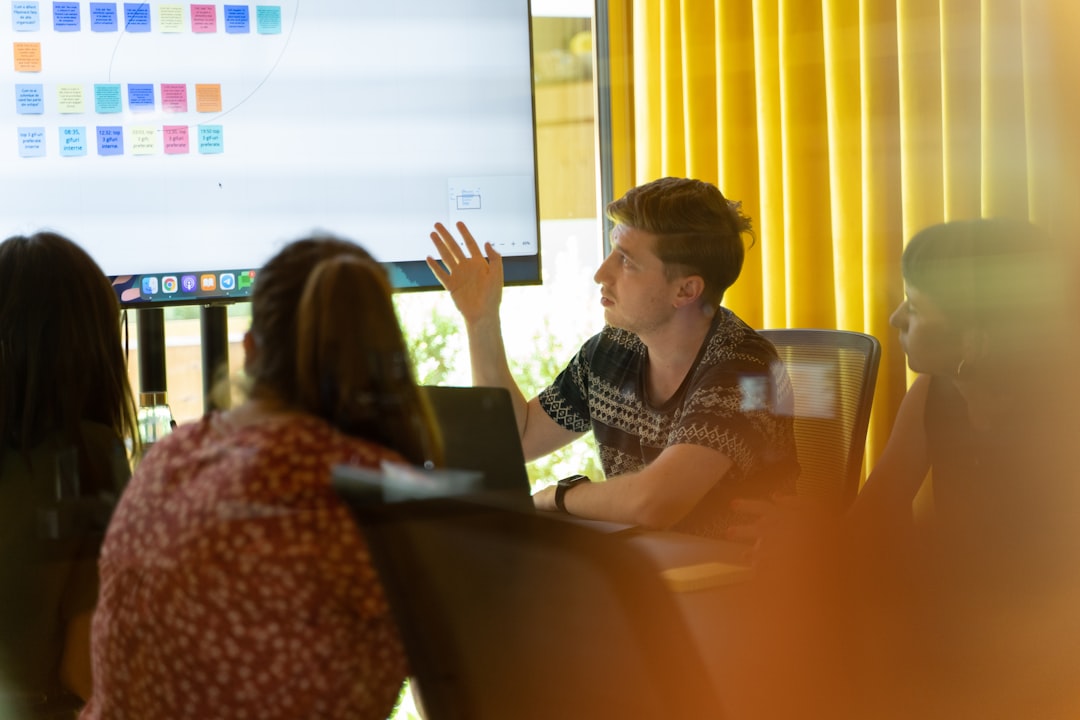 Presenter giving a wireless screen-share presentation to a business audience