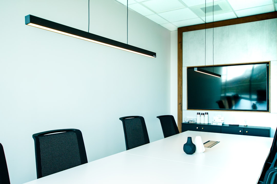 Conference room set up with a table and chairs for video meetings