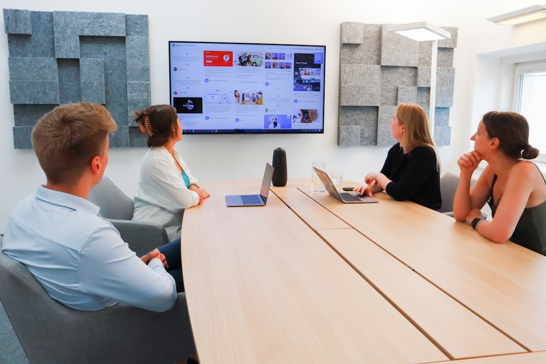 Group of people around a conference table during a business meeting