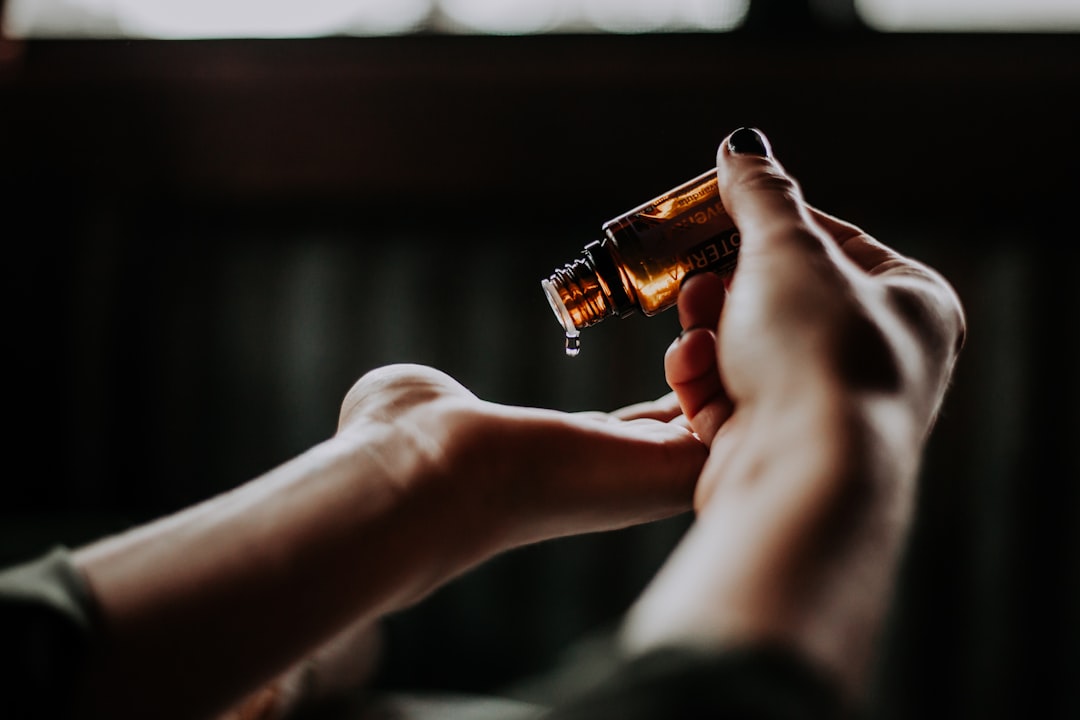 Amber glass bottle of Ayurvedic massage oil