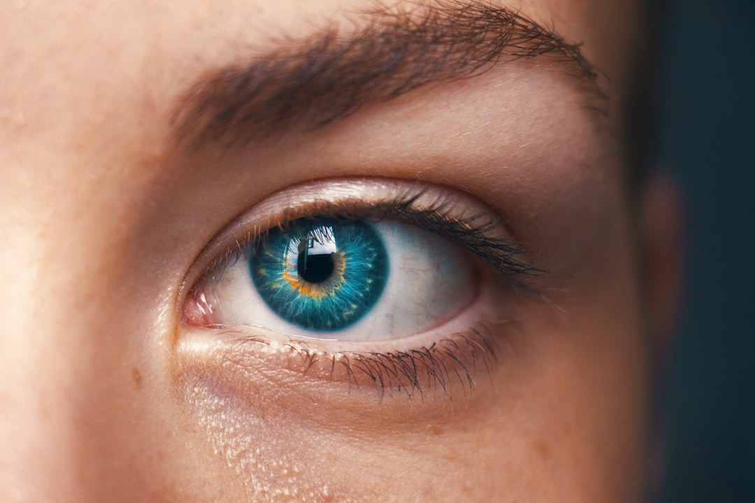 Close-up of skin near the eye showing fine lines and delicate under-eye texture