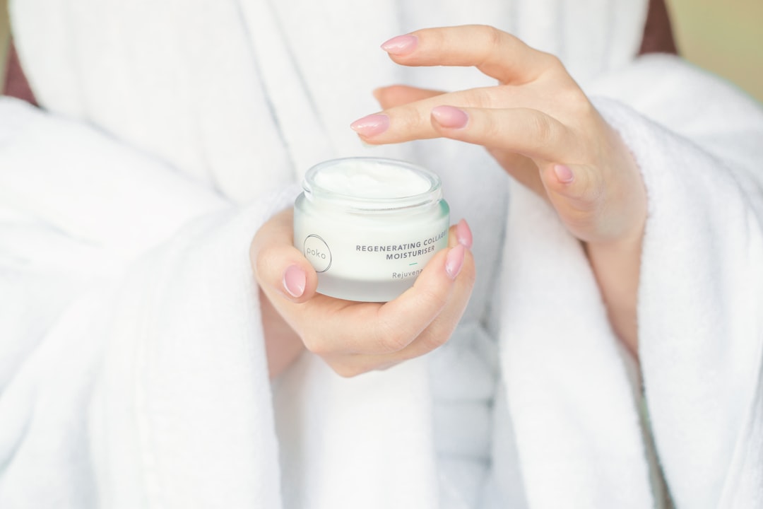 Esthetician applying collagen eye treatment product near the eye area