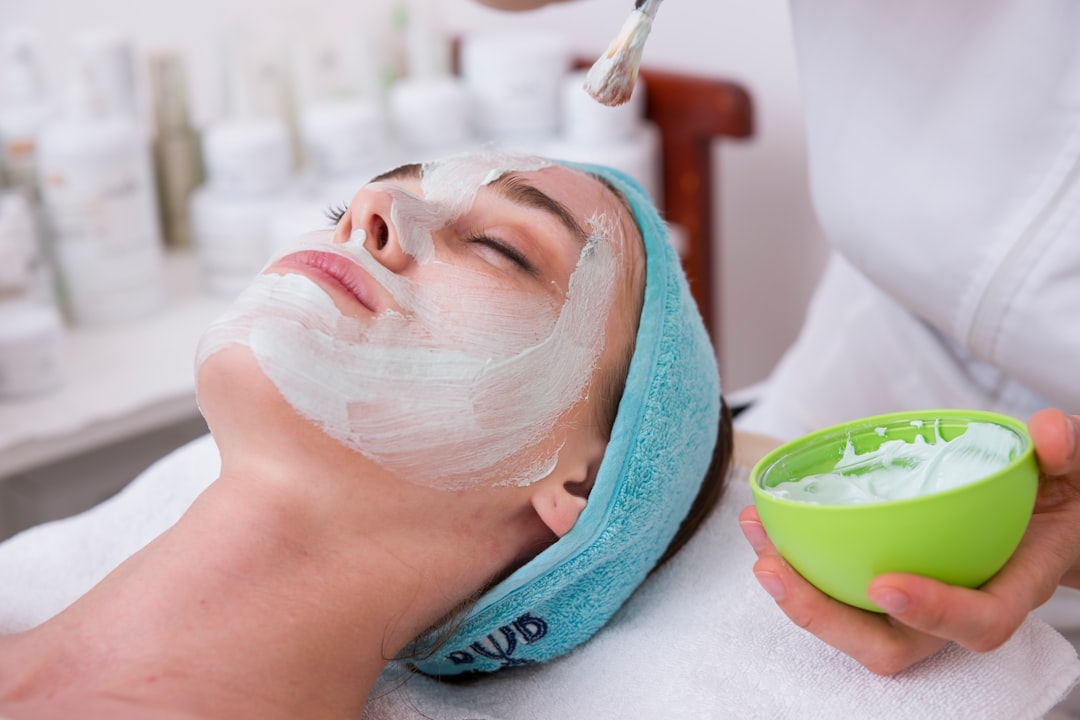 Client receiving a facial skincare treatment at a clinic