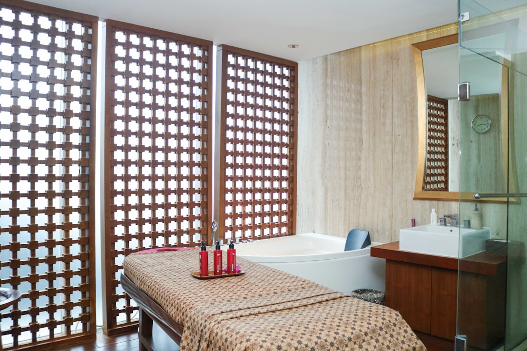 Serene spa treatment room with massage table for Ayurvedic oil therapy