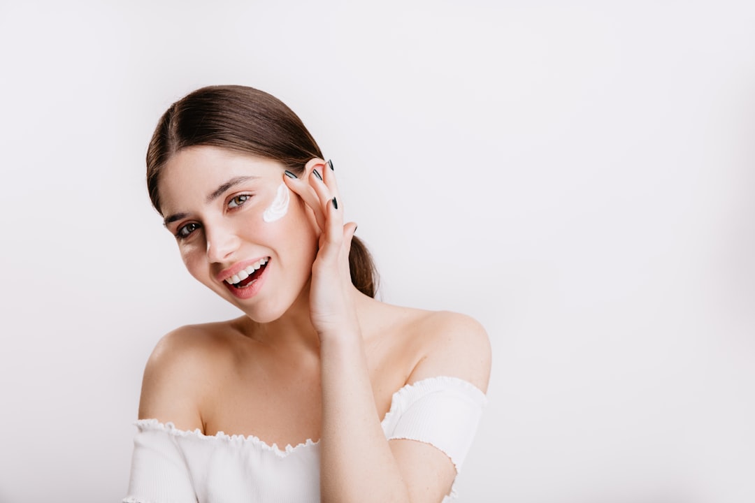 Woman with radiant, glowing skin after a facial skin management treatment