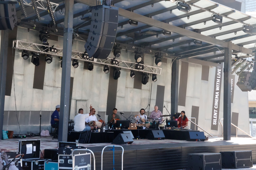 Outdoor event stage with sound equipment under cover