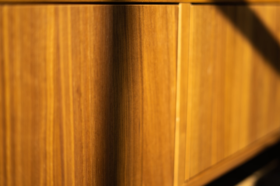 Wood veneer cabinet drawer detail showing grain