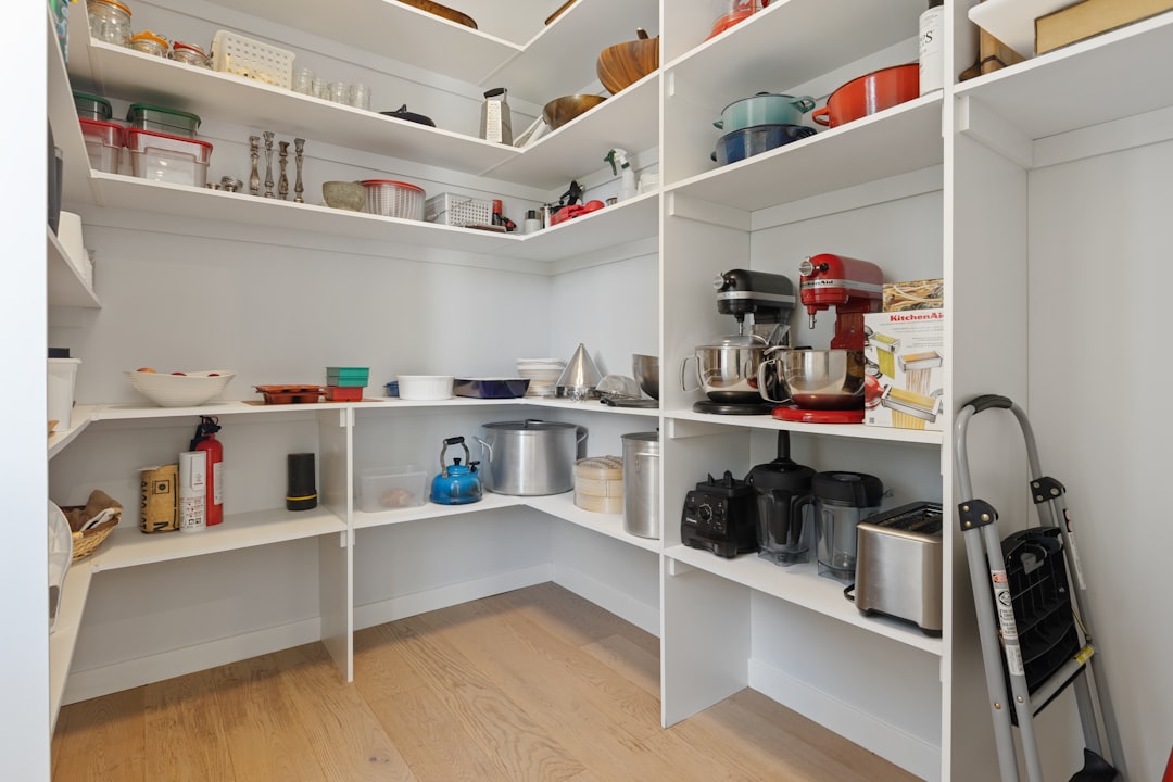 Walk-in pantry with organized wooden shelving