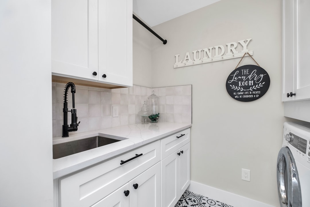 Laundry room with sink, washer, and dryer