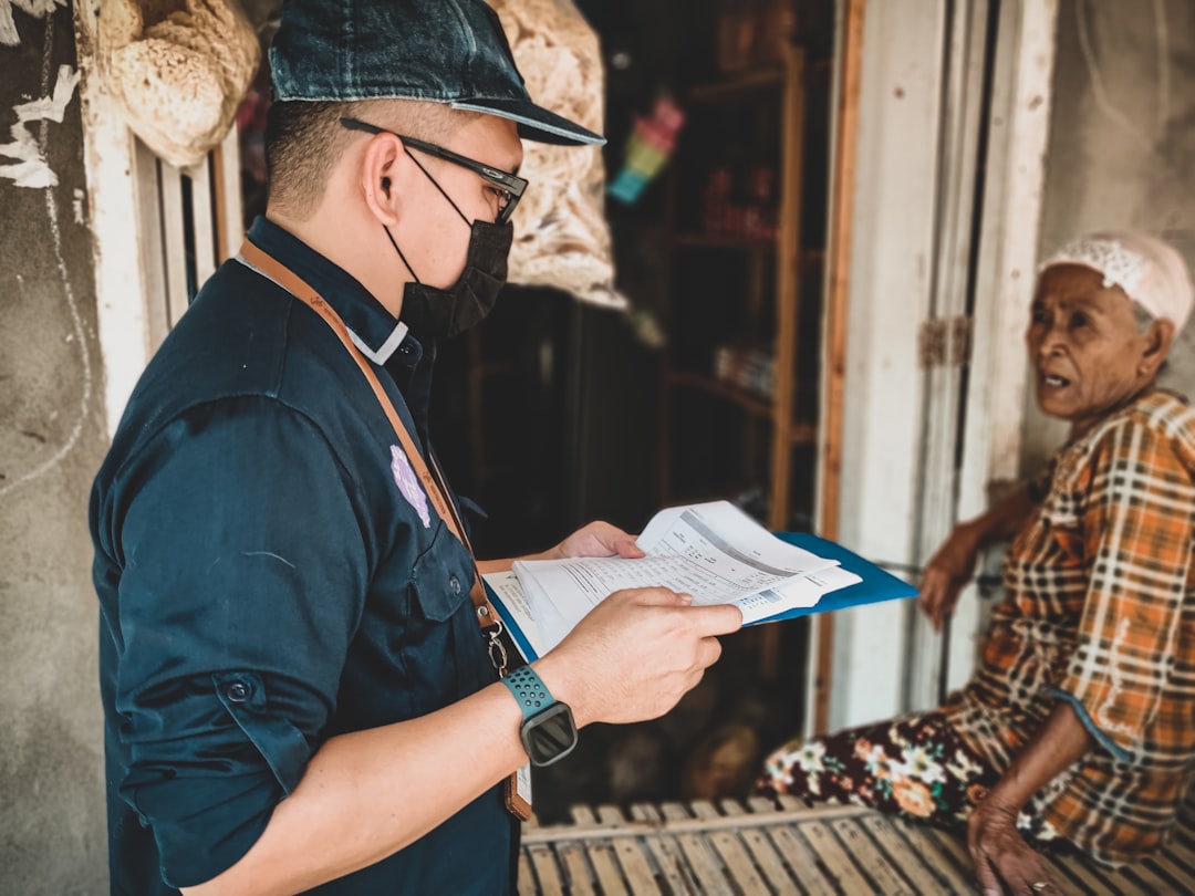 Driver reviewing shipment paperwork before a delivery