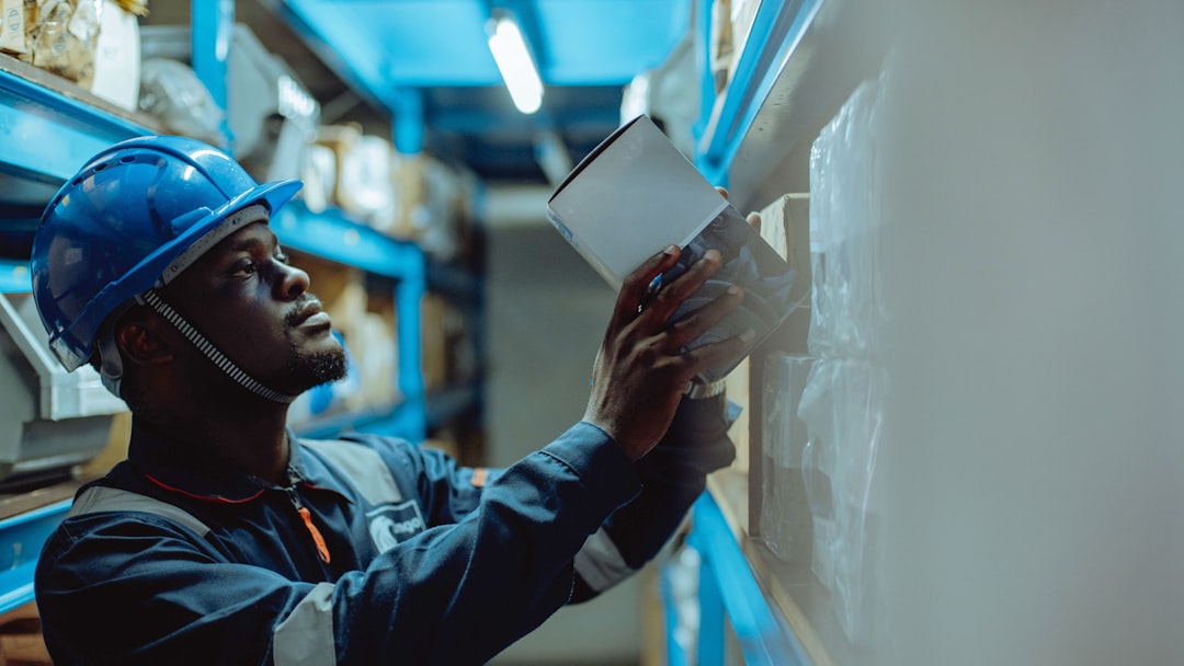 Worker confirming delivery details before a shipment leaves the dock