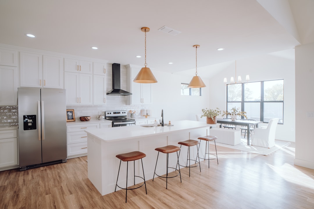 Luxury vinyl plank flooring in a modern kitchen with an island
