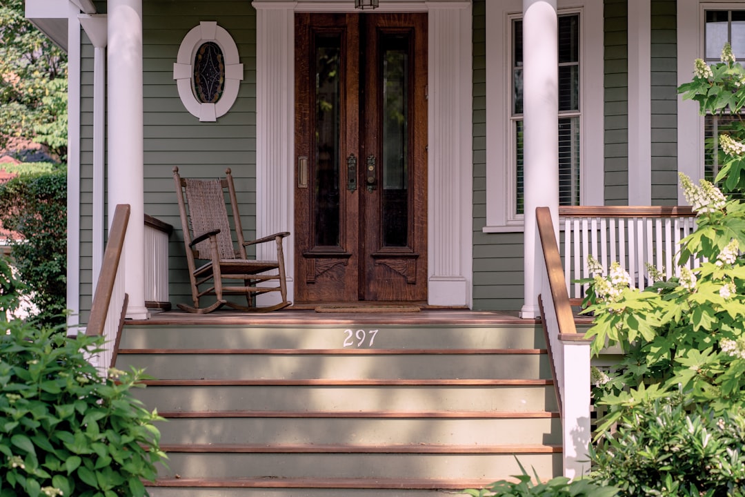 Traditional wood panel entry door on a Craftsman-style home