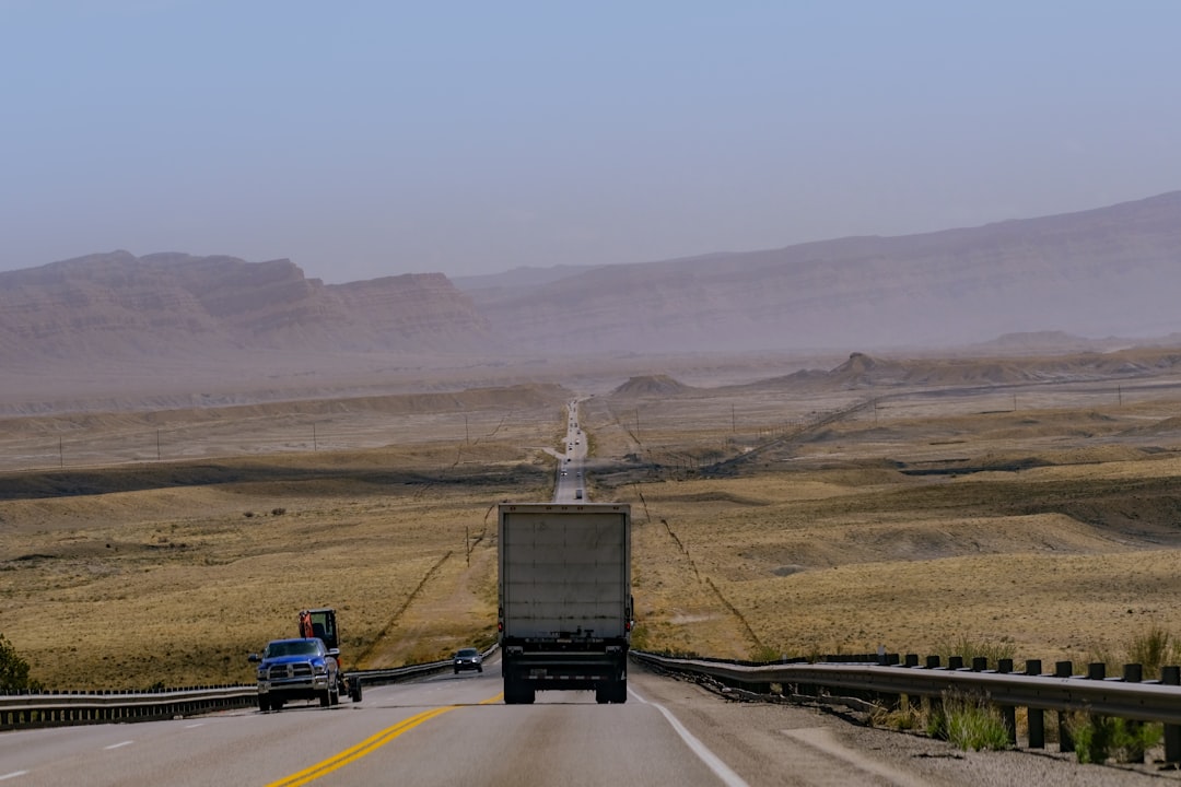 Semi truck driving down a highway, representing linehaul distance in freight pricing