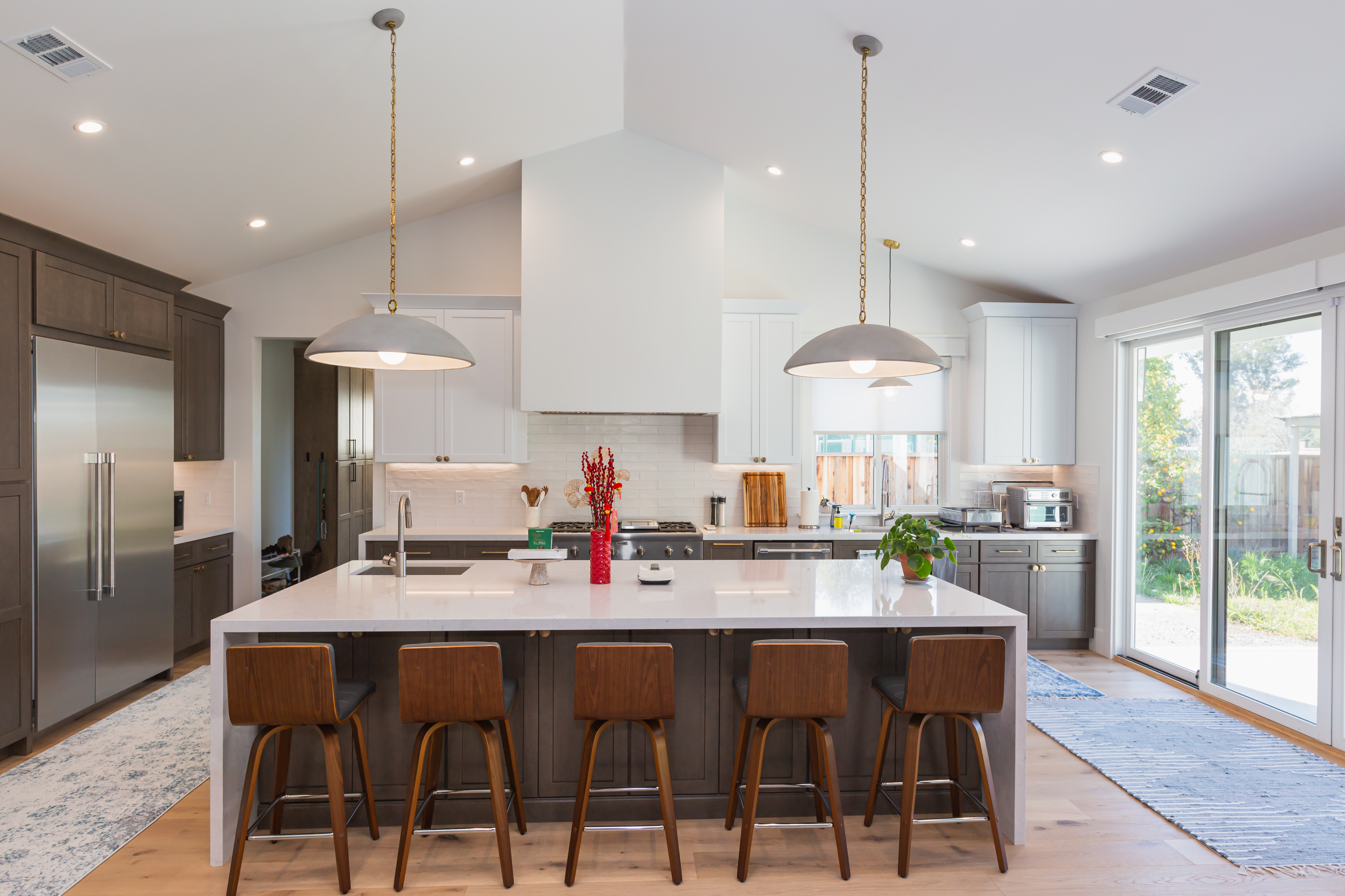 Cabinetry-grade fitted storage with full-height doors and clean reveals