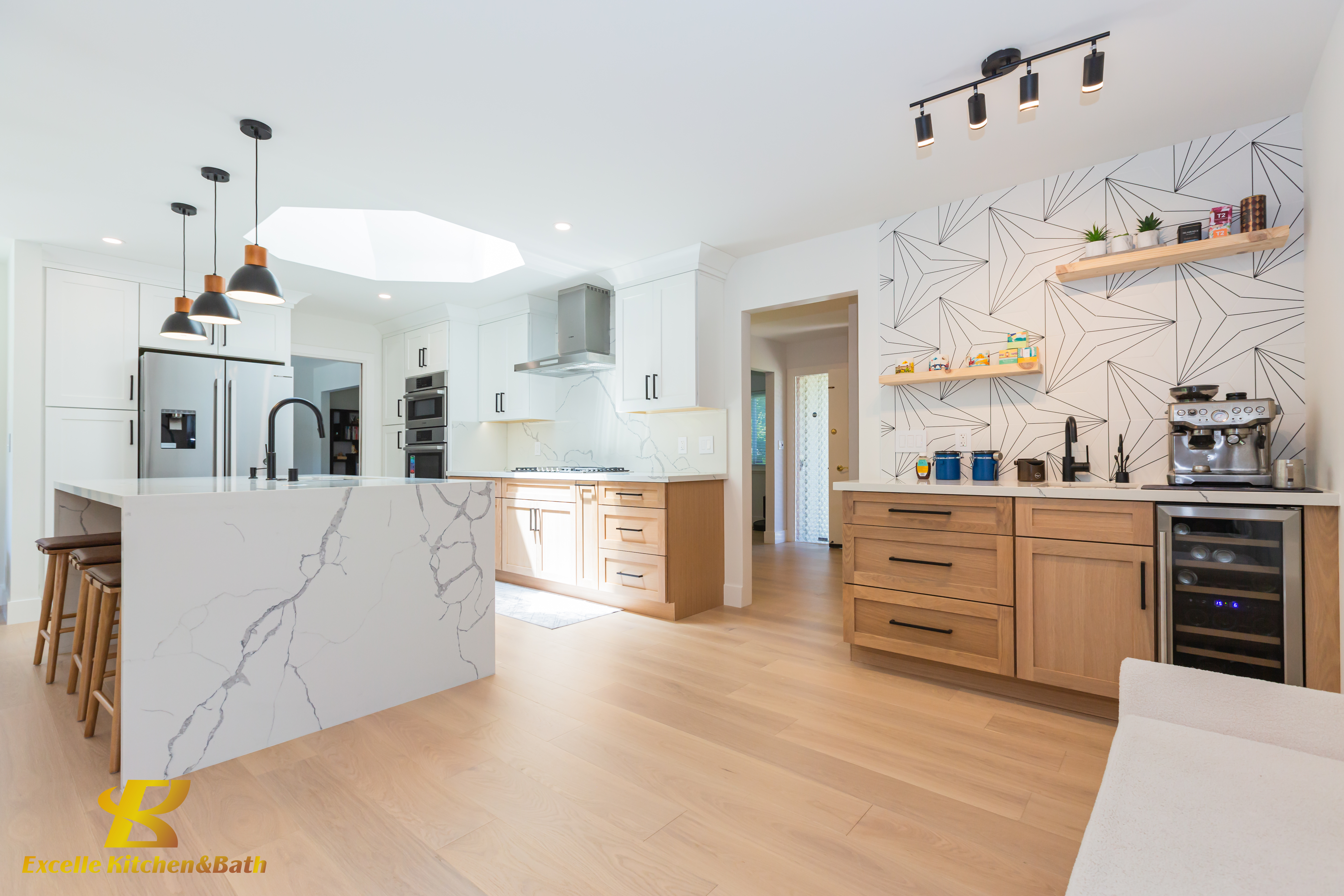 Installed kitchen with painted cabinetry and full-height storage wall